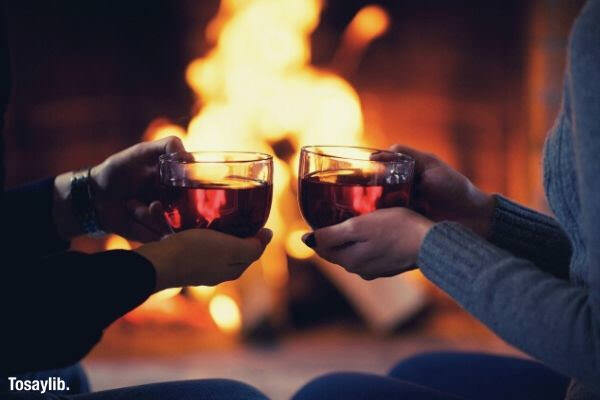 couple toasting fireplace