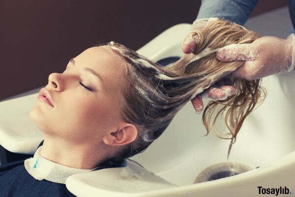 woman shampoo salon relax