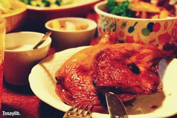 feast foods chicken fork knife