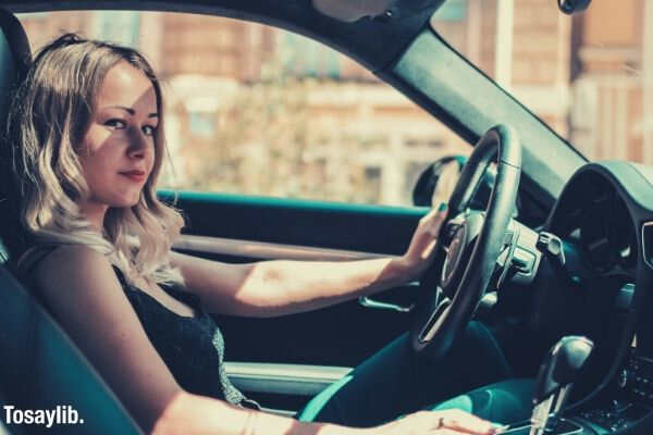 girl riding driving a car