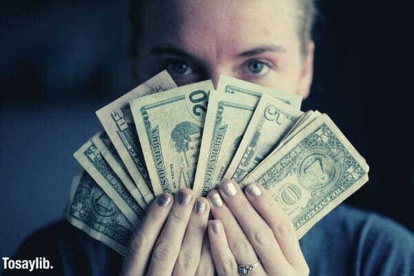 woman holding dollar bills