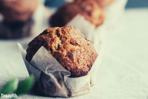 baked muffins on beige surface