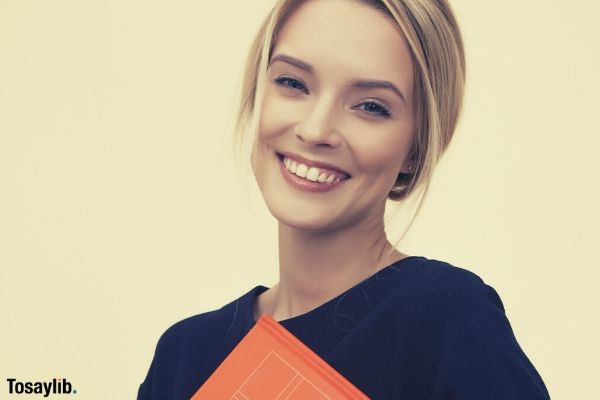 woman smiling black orange folder