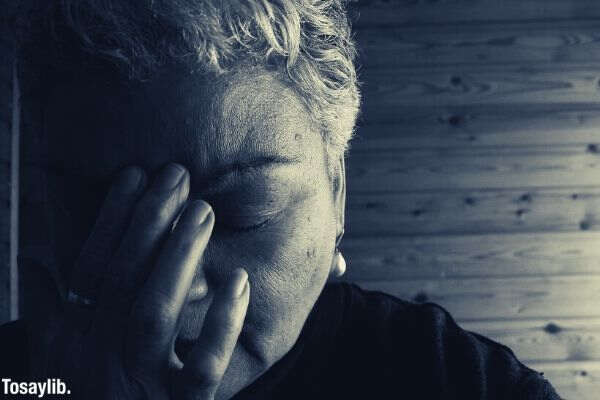 black and white old woman sad