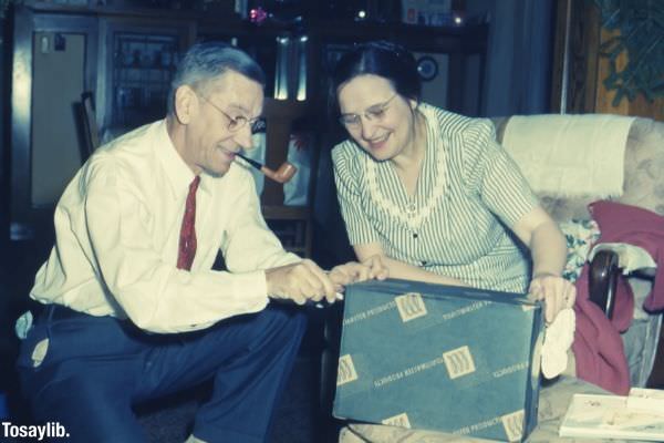 man and woman holding black box