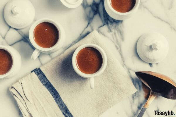 white tea cup filled with red liquid