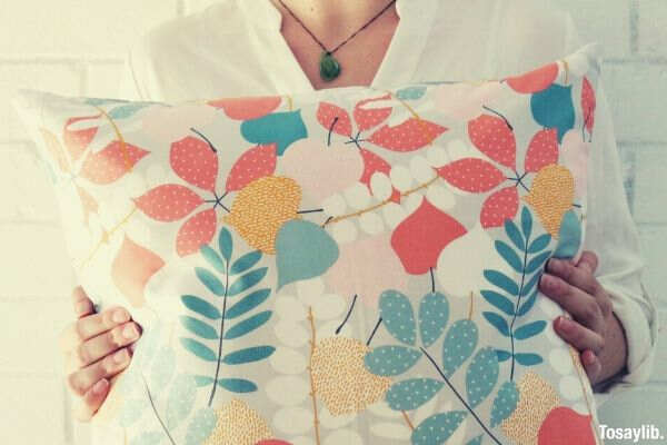 woman holding pillow