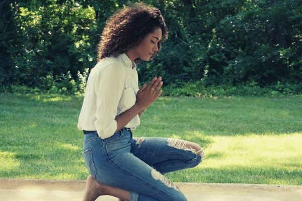 girl grass praying curly hair