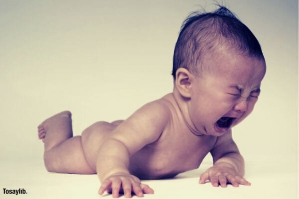 naked baby crying