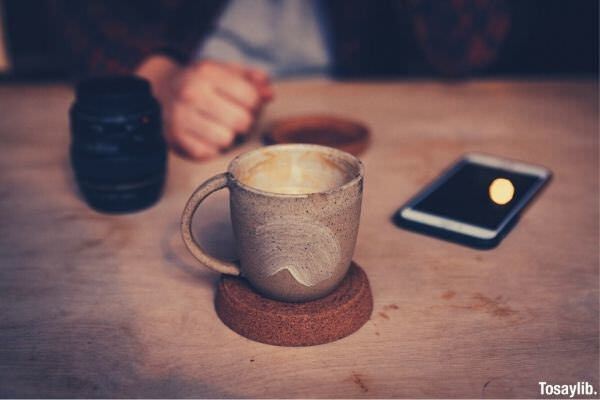 brown coffee cup and saucer