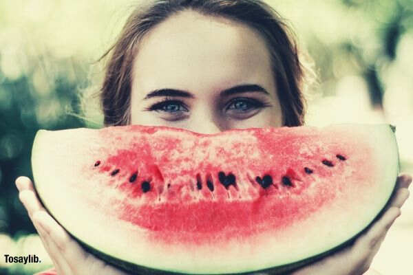 woman holding watermelon