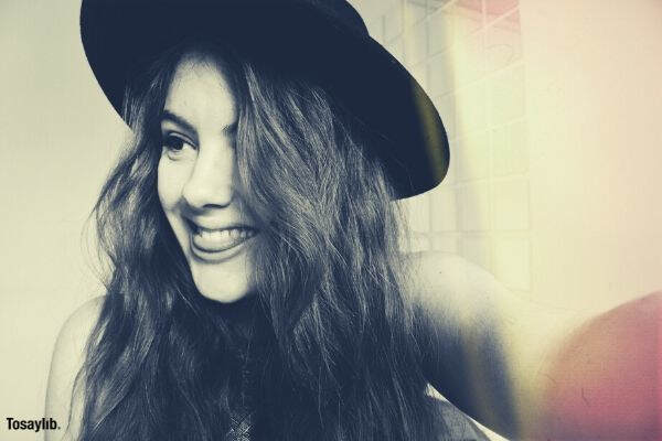 woman smiling black hat black white photo