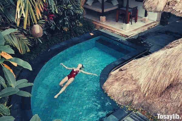 woman-soaking-in-the-swimming-pool