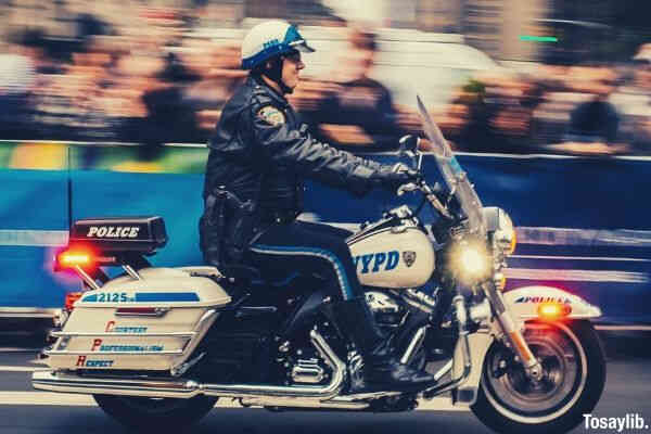 policeman riding a white motorcycle