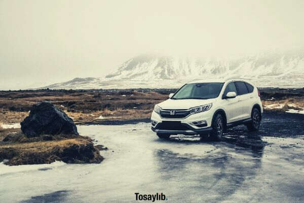 white Honda SUV land mountain