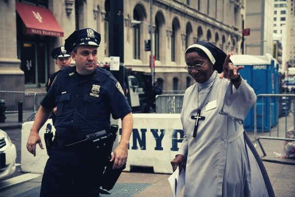 policeman-assisting-a-nun