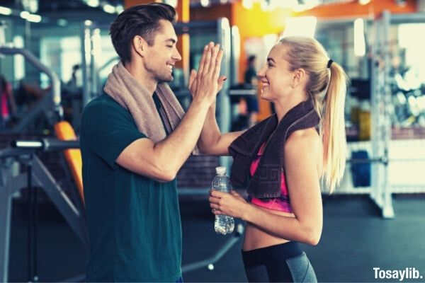 high five gym man and woman