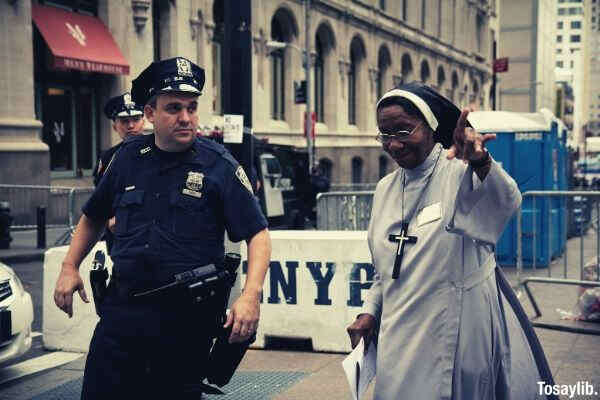 policeman assisting a nun