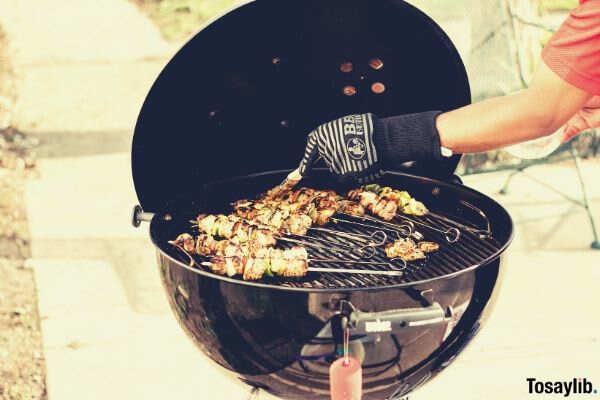 person grilling delicious food