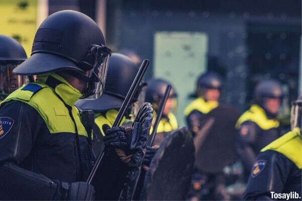 policeman holding a baton and a shield