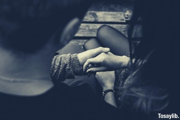 close up of couple holding hands