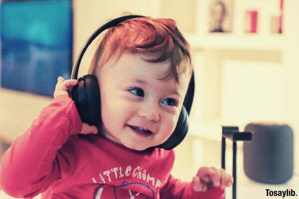 baby listening to black headset