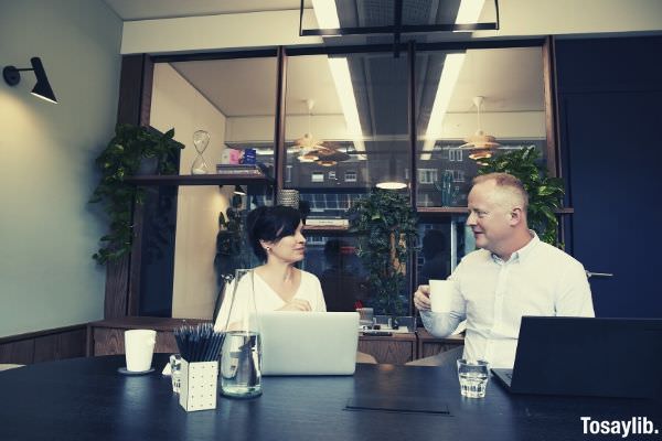 man and woman having a meeting in the office