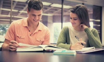 foreign-college-couple-studying-on-their-own