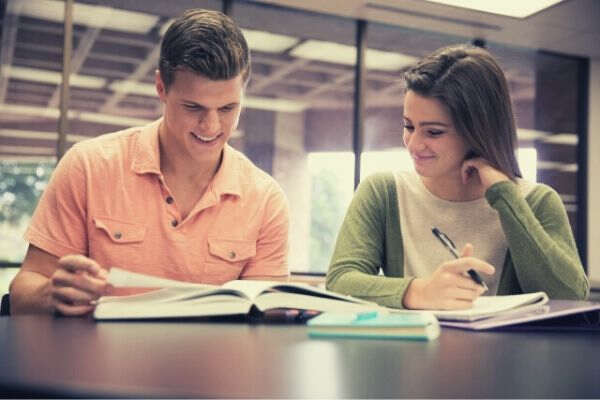 foreign-college-couple-studying-on-their-own