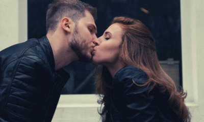 kissing-couple-wearing-black-jackets