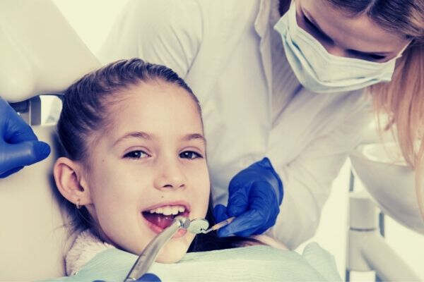 little girls receiving dental treatment