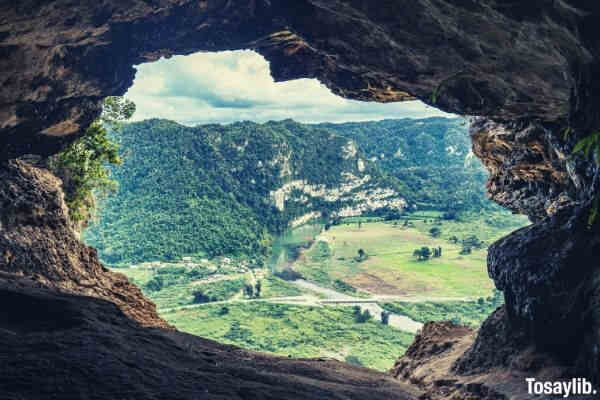 cave shot green grass field