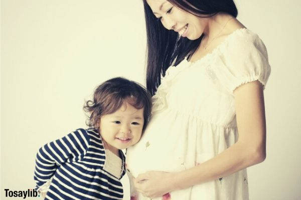 little girl listening mommys pregnant womb