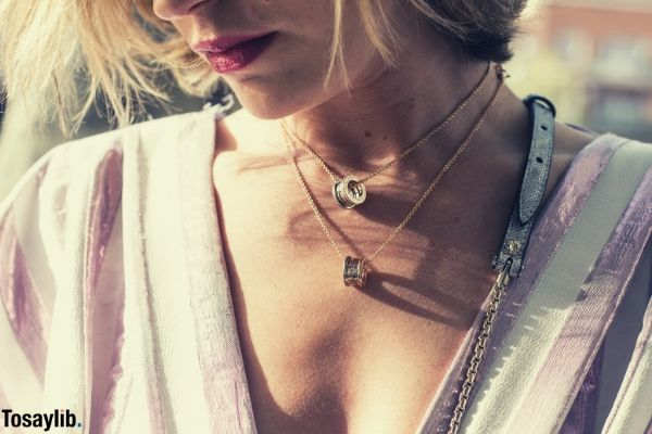 woman wearing pink dress necklace ring pendant