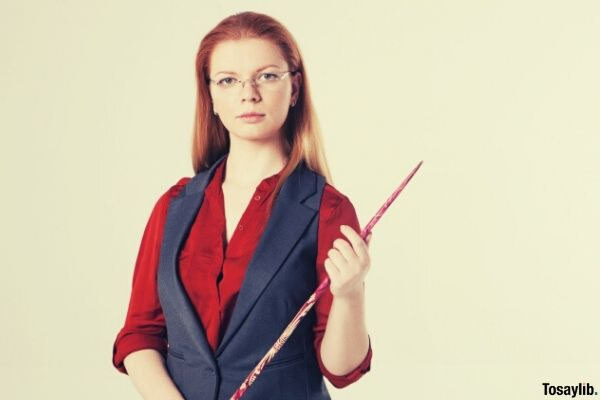 female teacher holding a stick