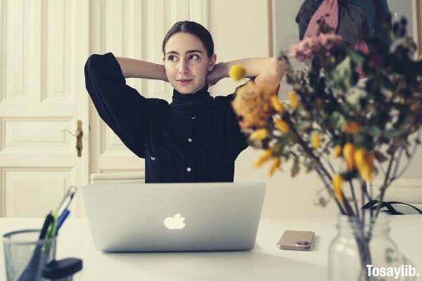 woman sitting in front of laptop