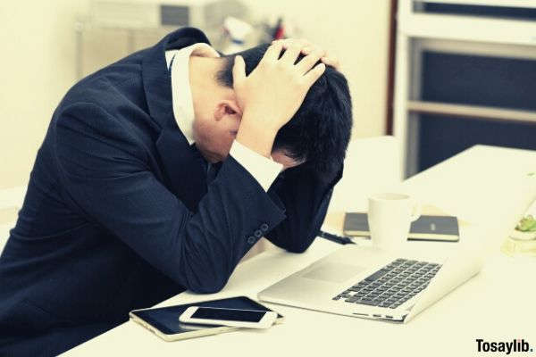 man businessman holding his head