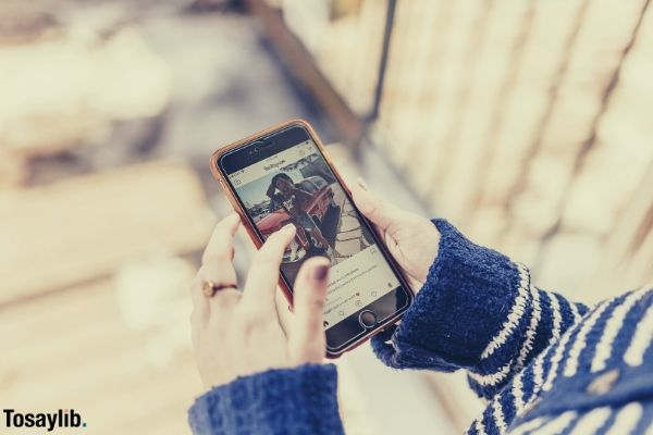 woman using smartphone looking at instagram
