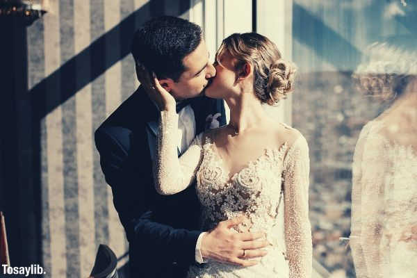 groom kissing his lovely wife