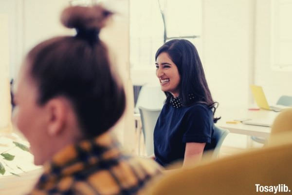 02 smiling woman in blue shirt photo