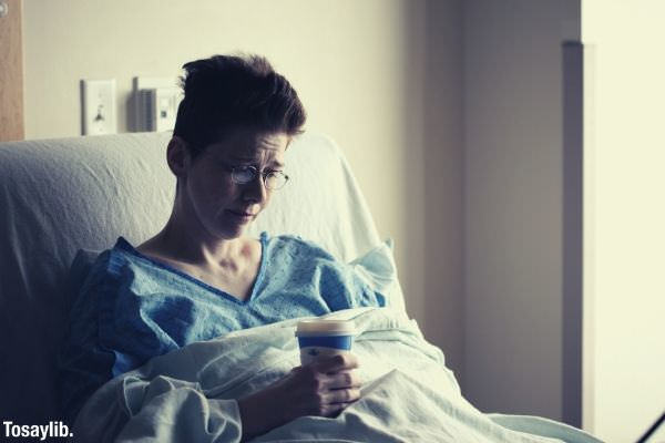 02 photo of a woman on bed holding a cup of hot drink