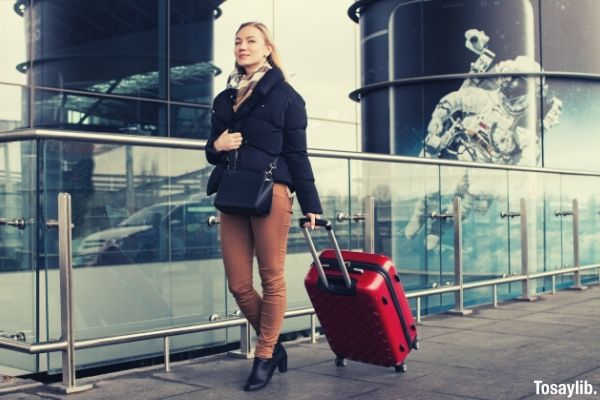 09 woman walking with luggage bag