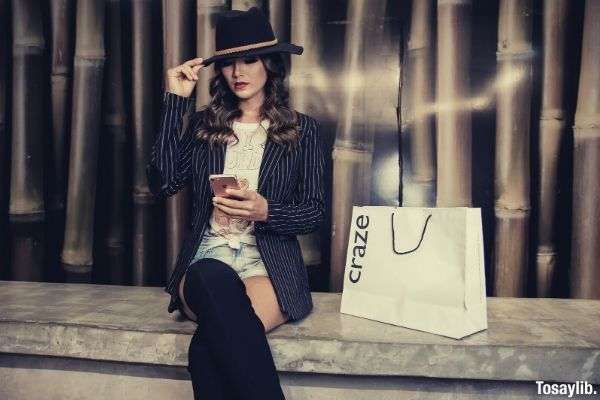 photo of a woman sitting near paperbag