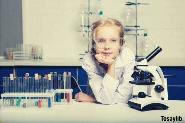 child experiment test tubes microscope