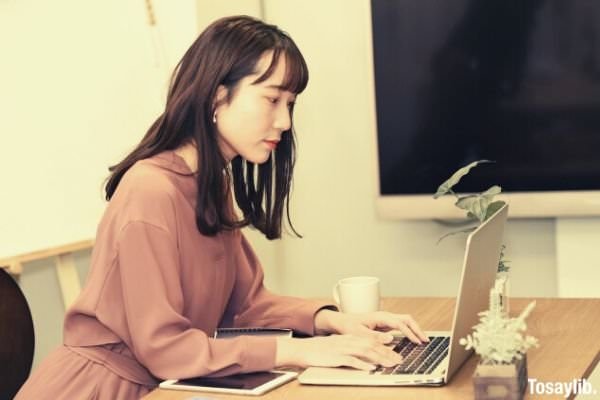 woman operating a laptop