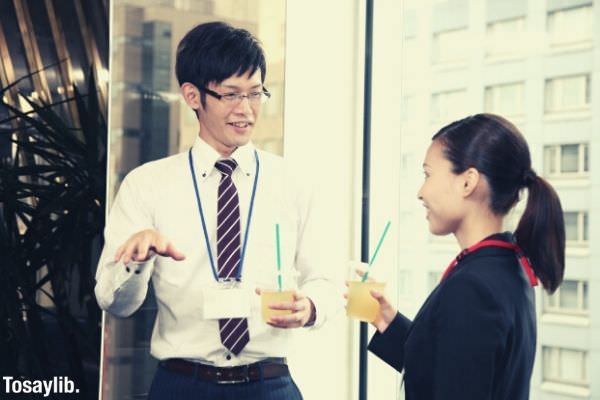 man and woman drinking juice