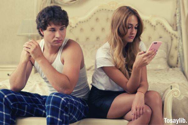 men who care about smartphones seen by women in bed
