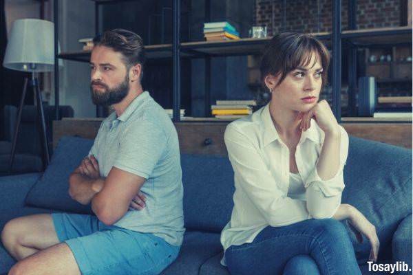 04 man in blue shirt and woman not talking to each other