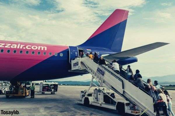 people going inside a big airplane