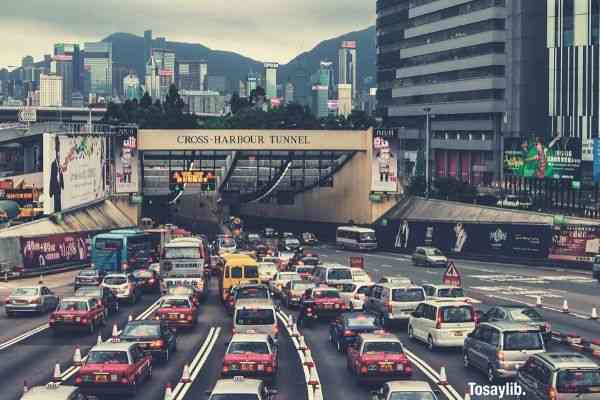 buildings cars city cross harbour tunnel